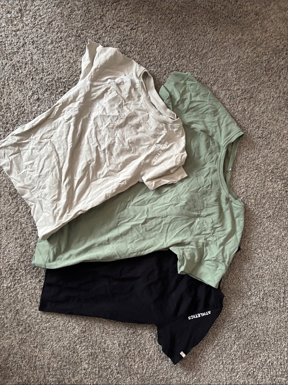 Three compression workout shirts
